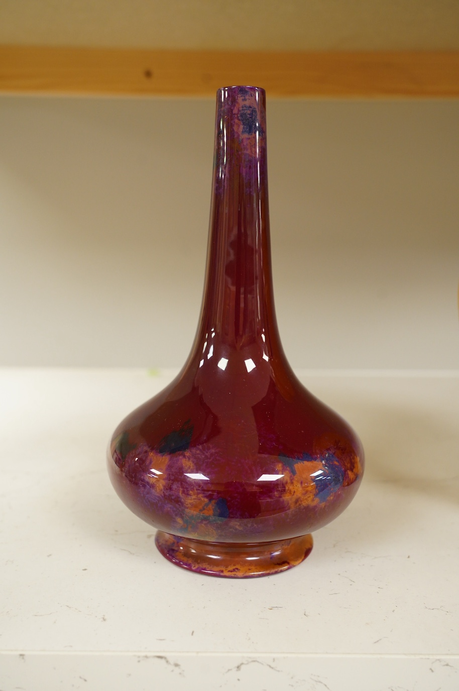 An early Royal Doulton flambé lustre bottle vase, early 20th century, 24cm high. Condition - good